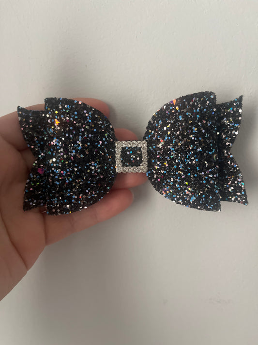 Glittery black party bow large on clip